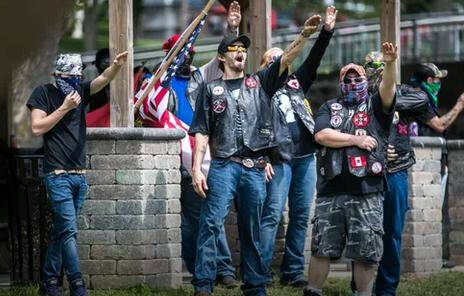 KKK members giving a Nazi salute