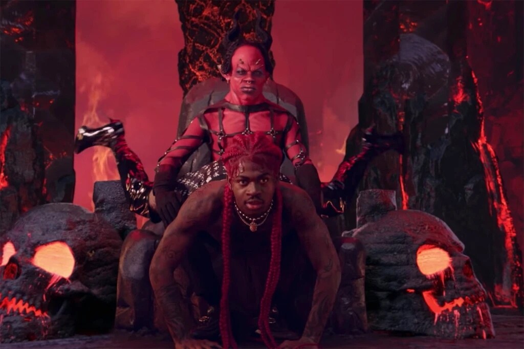 Still from video showing Lil Nas X straddling an actor dressed as Satan